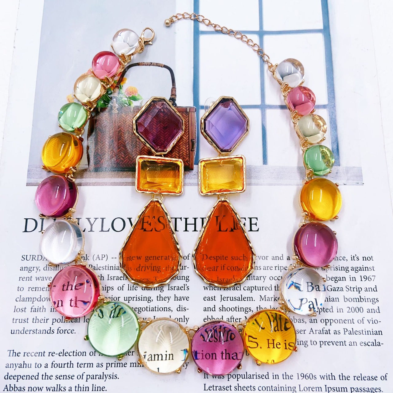 Colorful beaded necklace on a newspaper background