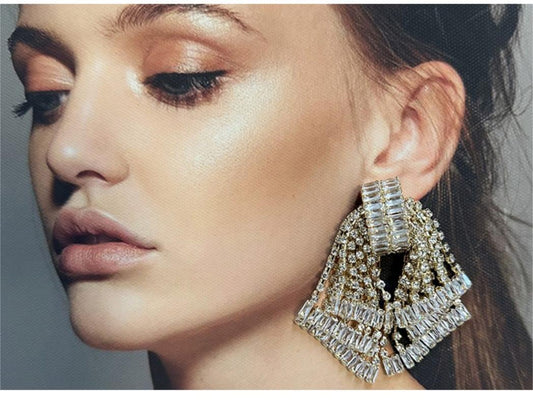 Crystal Cascade Bow Statement Earrings – Gold Finish.